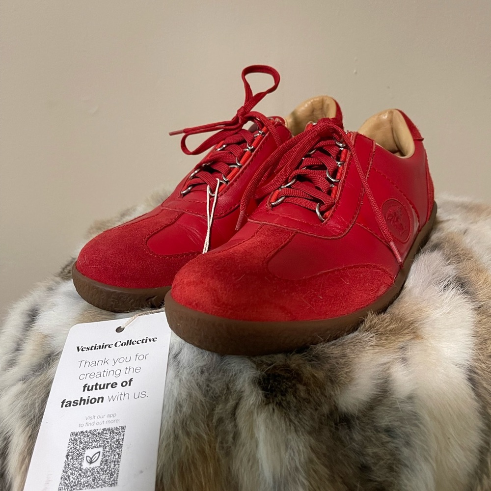 Women candy apple red suede Versace trainers.